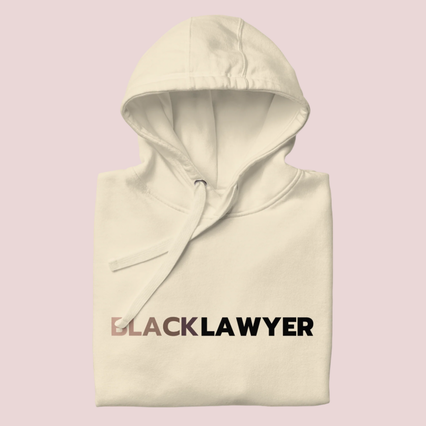 A cream hoodie with the words "Black Lawyer" on it.