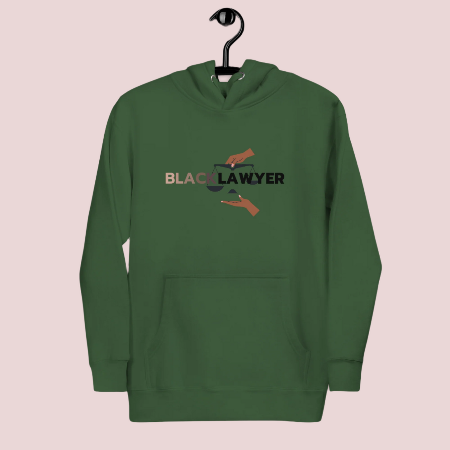 A green hoodie with the words "Black Lawyer" on it and a woman's hand holding an imbalanced justice scale.