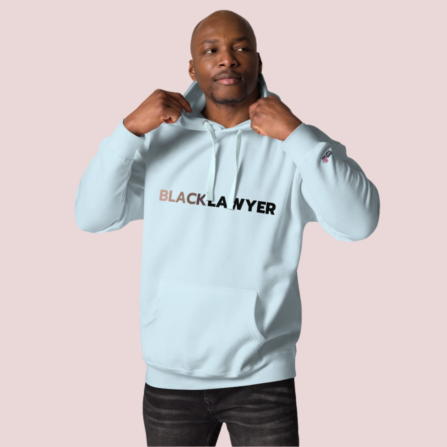 A model wearing black pants and an ice blue hoodie with the words "Black Lawyer" on it.