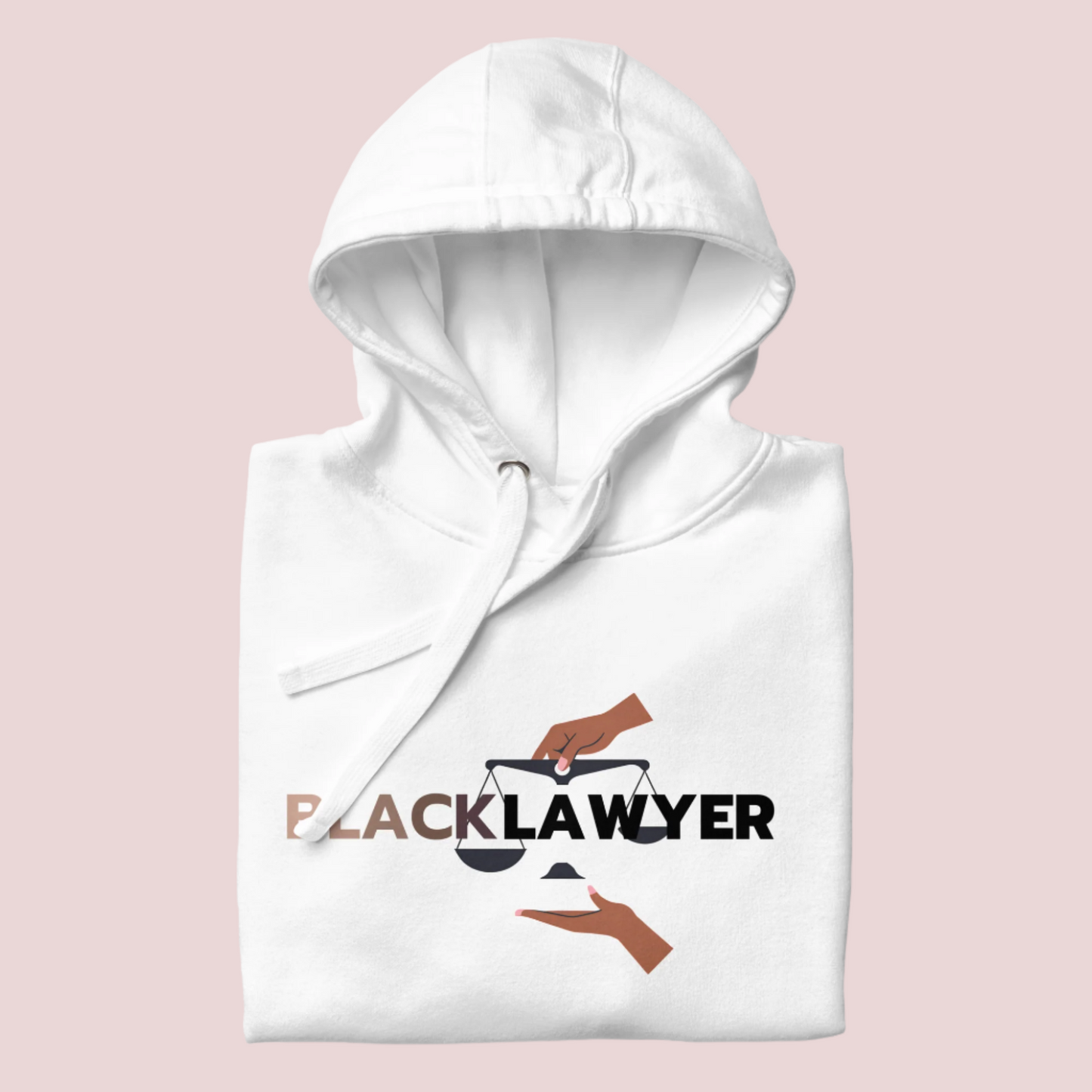 A white hoodie with the words "Black Lawyer" on it and a woman's hand holding an imbalanced justice scale.