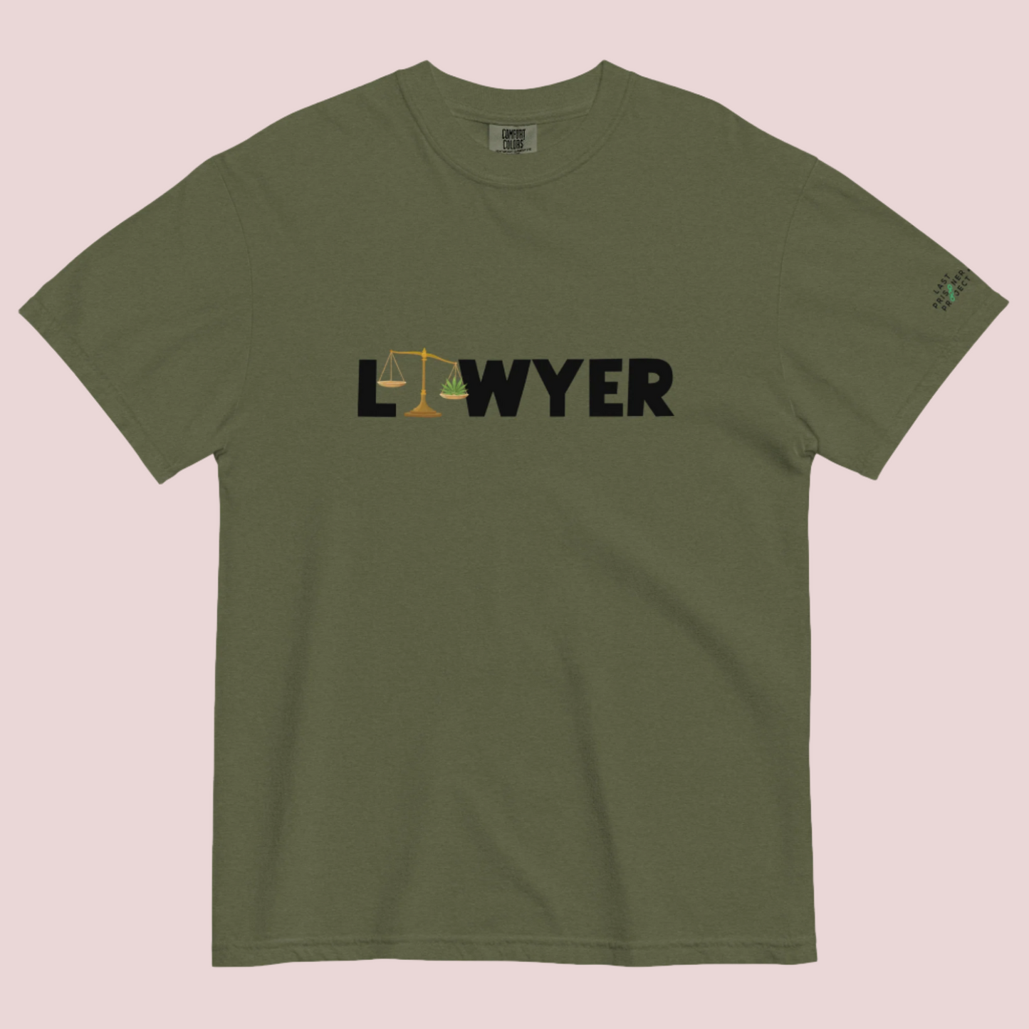 An army green crewneck tee showing the text "LAWYER", with the letter "A" stylized as a set of tilted justice scales, with one scale pan containing cannabis leaves while the other pan remains empty, with The last Prisoner Project x The Counselle Collection logo on the left sleeve.