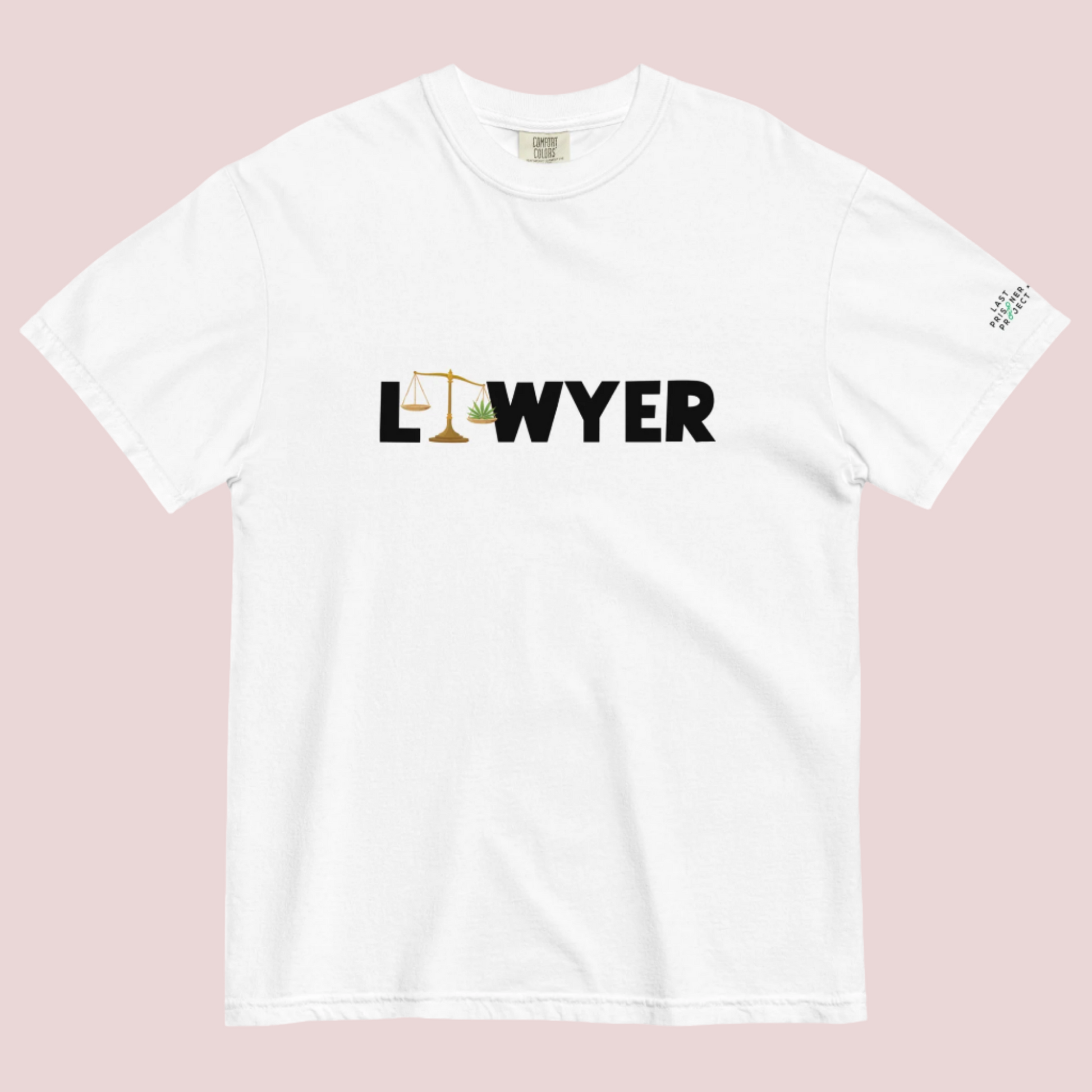 A white crewneck tee showing the text text "LAWYER", with the letter "A" stylized as a set of tilted justice scales, with one scale pan containing cannabis leaves while the other pan remains empty, with The last Prisoner Project x The Counselle Collection logo on the left sleeve.
