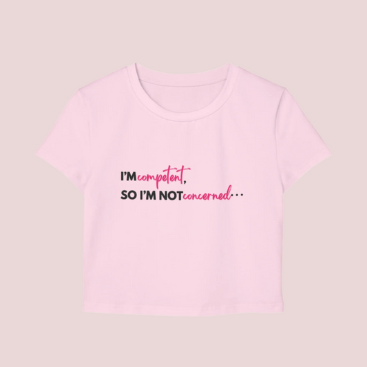A pink roundneck cropped tee with the slogan "I'm competent, so I'm not concerned".