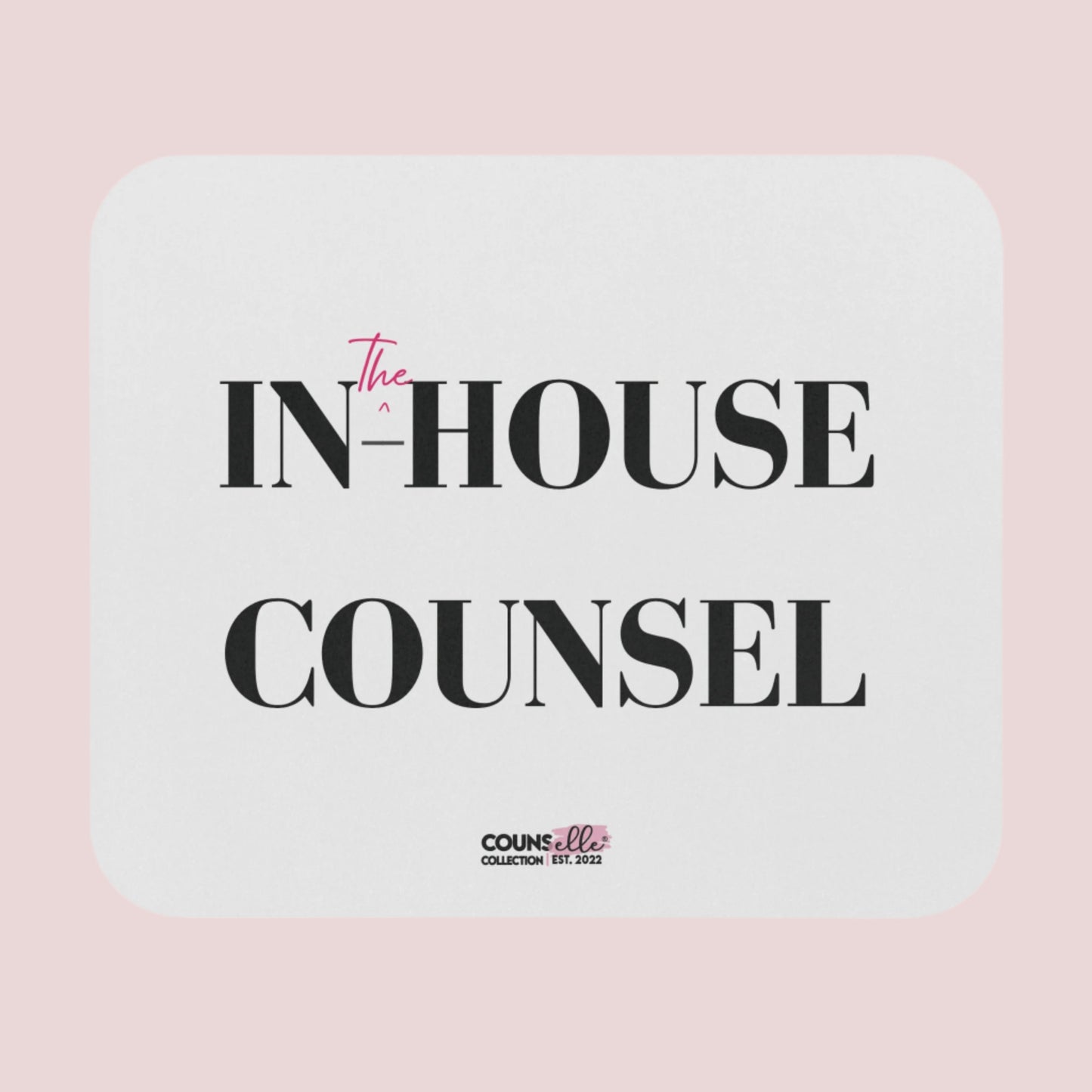 A rectangular, white mouse pad showing the text "IN", "^", "the", "-HOUSE", and COUNSEL", with the counsellecollection logo at the bottom of the design.