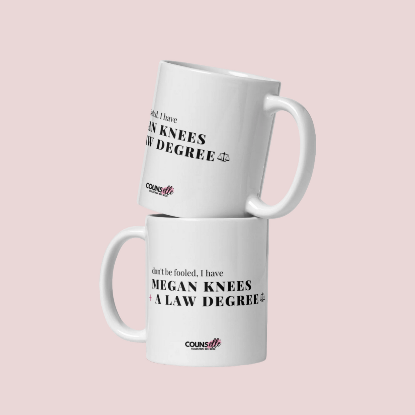Two ceramic mugs stacked on top of one another with the text "DON'T BE FOOLED, I'VE GOT MEGAN KNEES AND A LAW DEGREE" on the front.