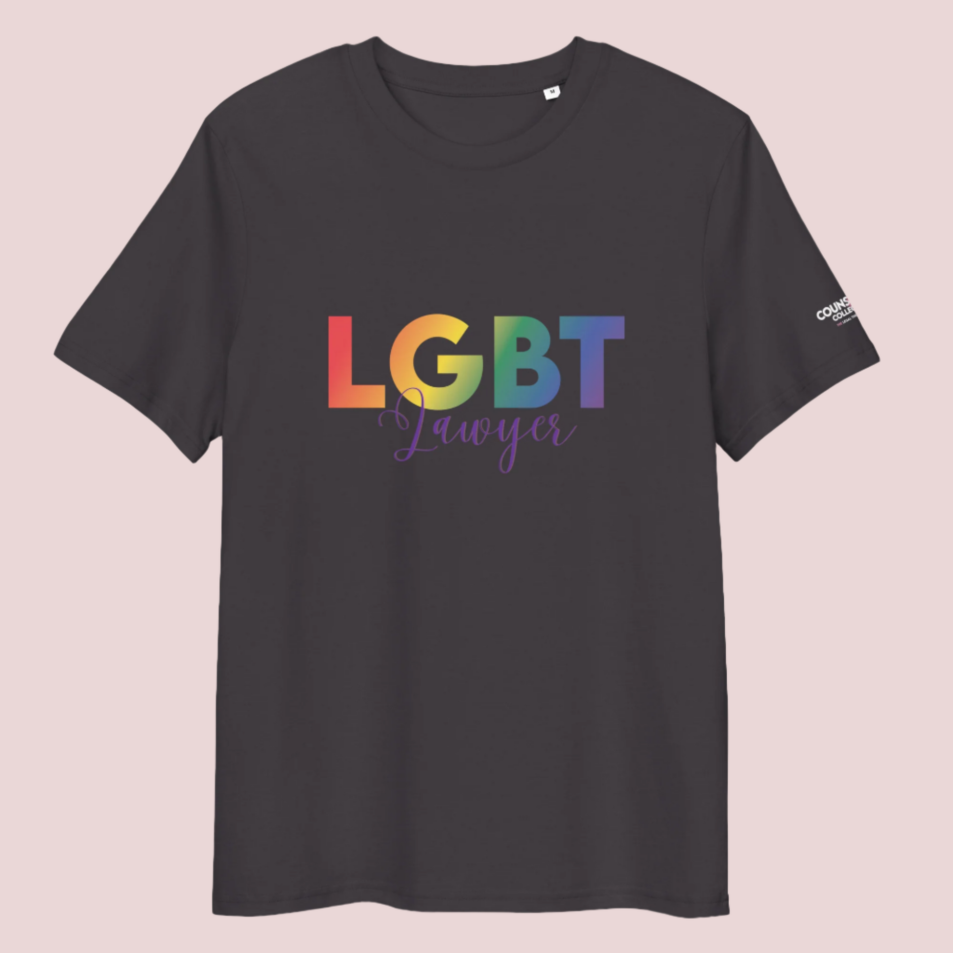 A dark grey crewneck tee showing the text  "LGBT" in a rainbow-colored font and "Lawyer" in blue script, with the counsellecollection logo on the left sleeve.