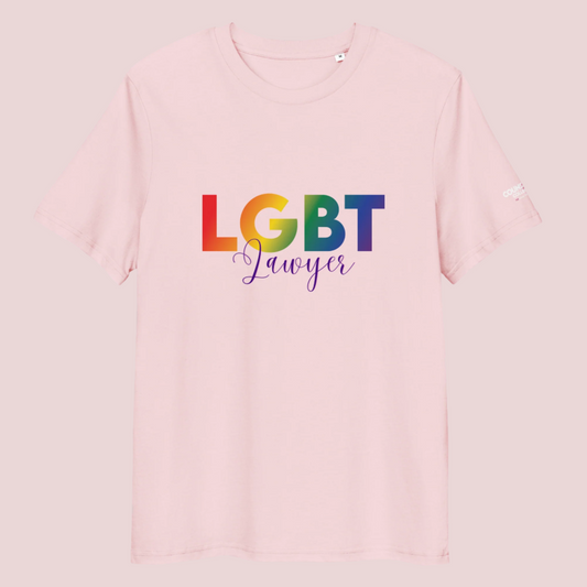 A pink crewneck tee showing the text  "LGBT" in a rainbow-colored font and "Lawyer" in blue script, with the counsellecollection logo on the left sleeve.