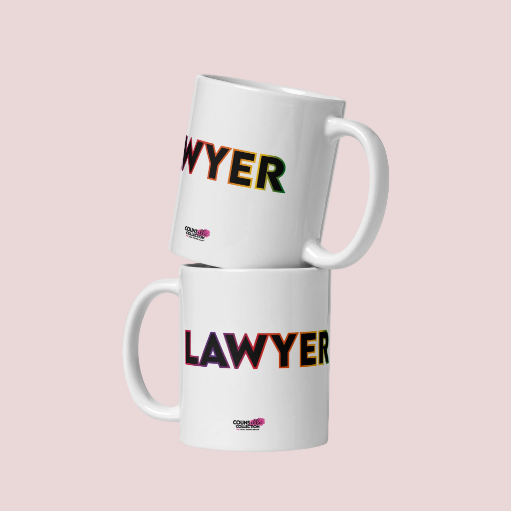 Two white mugs stacked on top of each other, showing the word "LAWYER" with a rainbow-colored outline, and the counsellecollection logo at the bottom of the design.
