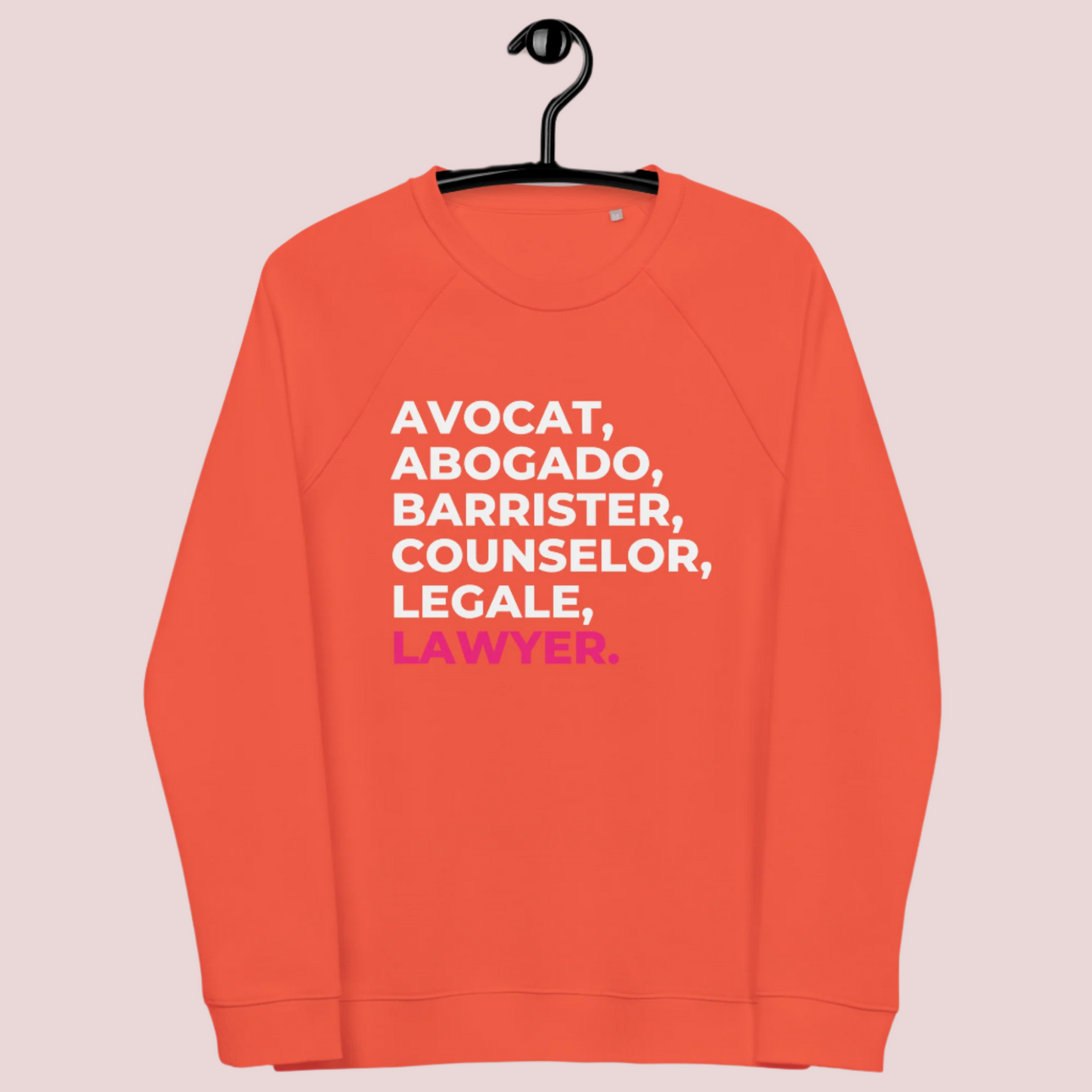 A pumpkin-orange, long-sleeved sweatshirt with the words "AVOCAT", "ABOGADO", "BARRISTER", "COUNSELOR", "LEGALE", and "LAWYER".