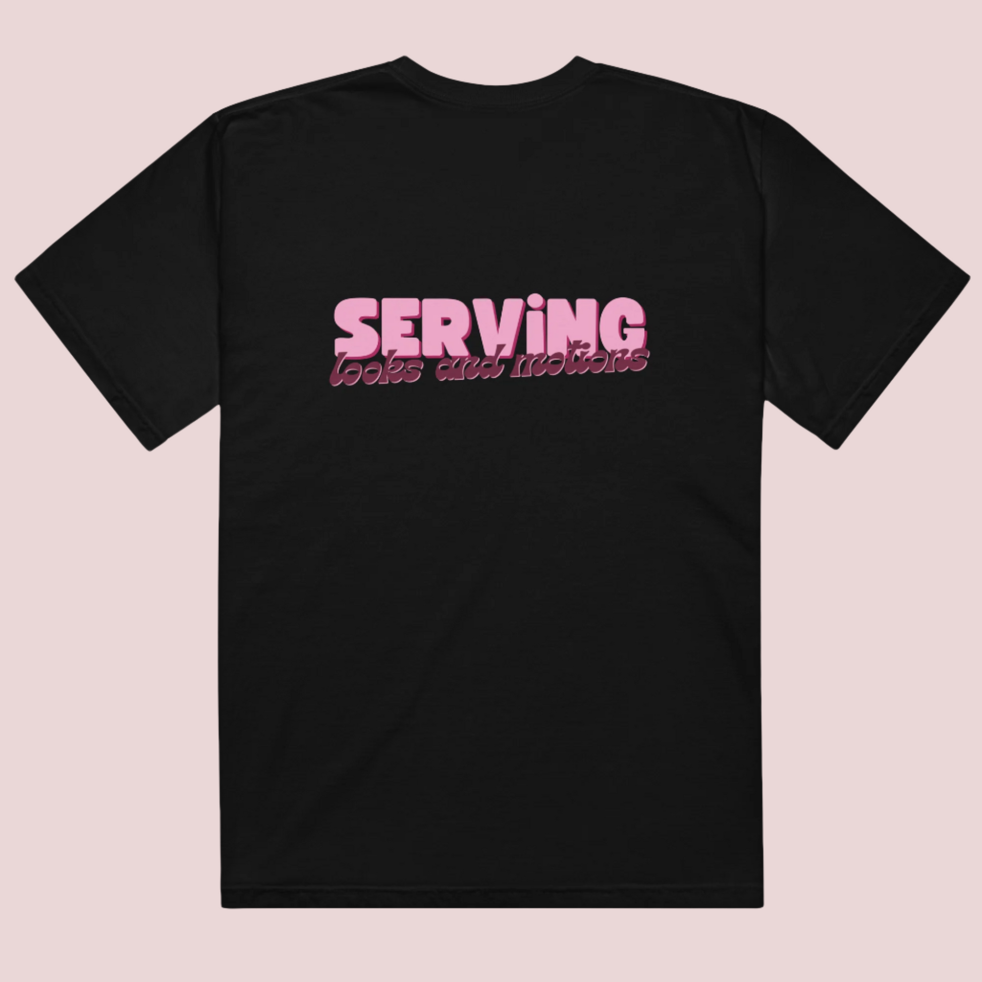 A black roundneck tee showing the text "SERVING looks and motions" in pink font.
