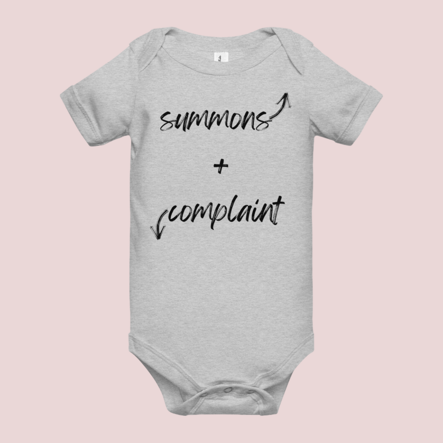 A heather grey infant onesie with an enveloped collar and three-snap closure, showing the text "summons" and an upward pointing arrow, and the text "complaint", and a downward pointing arrow.