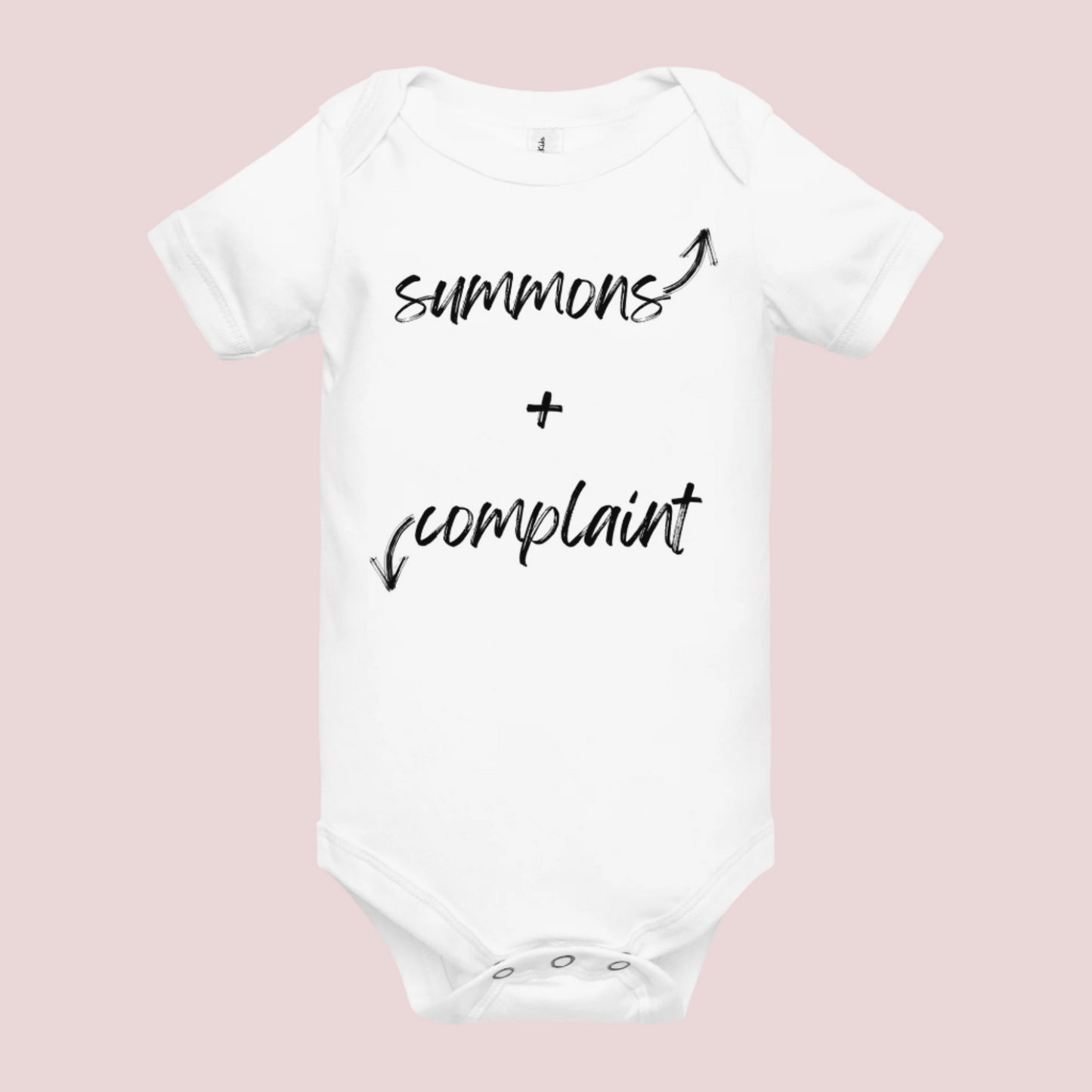 A white infant onesie with an enveloped collar and three-snap closure, showing the text "summons" and an upward pointing arrow, and the text "complaint", and a downward pointing arrow.