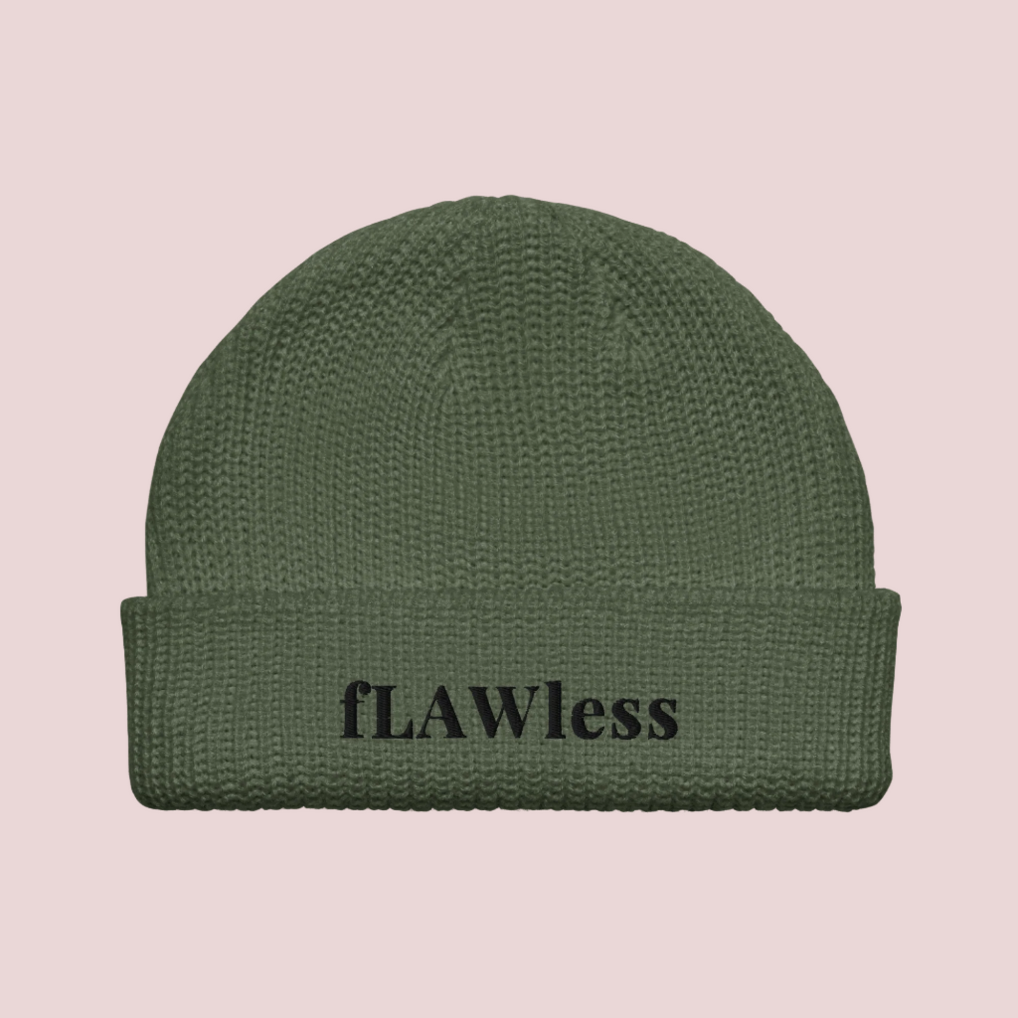 An army green beanie with the text "fLAWless" in black text written on it.