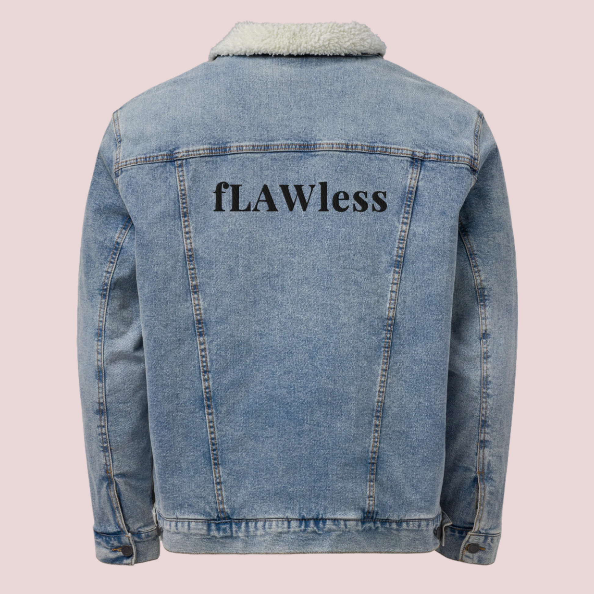 A denim jacket with a soft sherpa lining, showing the text "fLAWless" at the back.