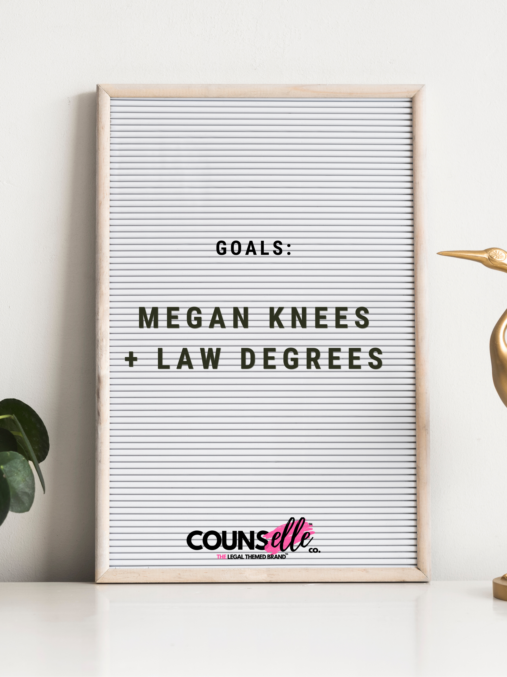 A minimalist poster featuring the text "GOALS: MEGAN KNEES AND LAW DEGREES" in bold sans serif font, set against a clean white ruled paper background. Perfect for law students and Megan Thee Stallion fans.