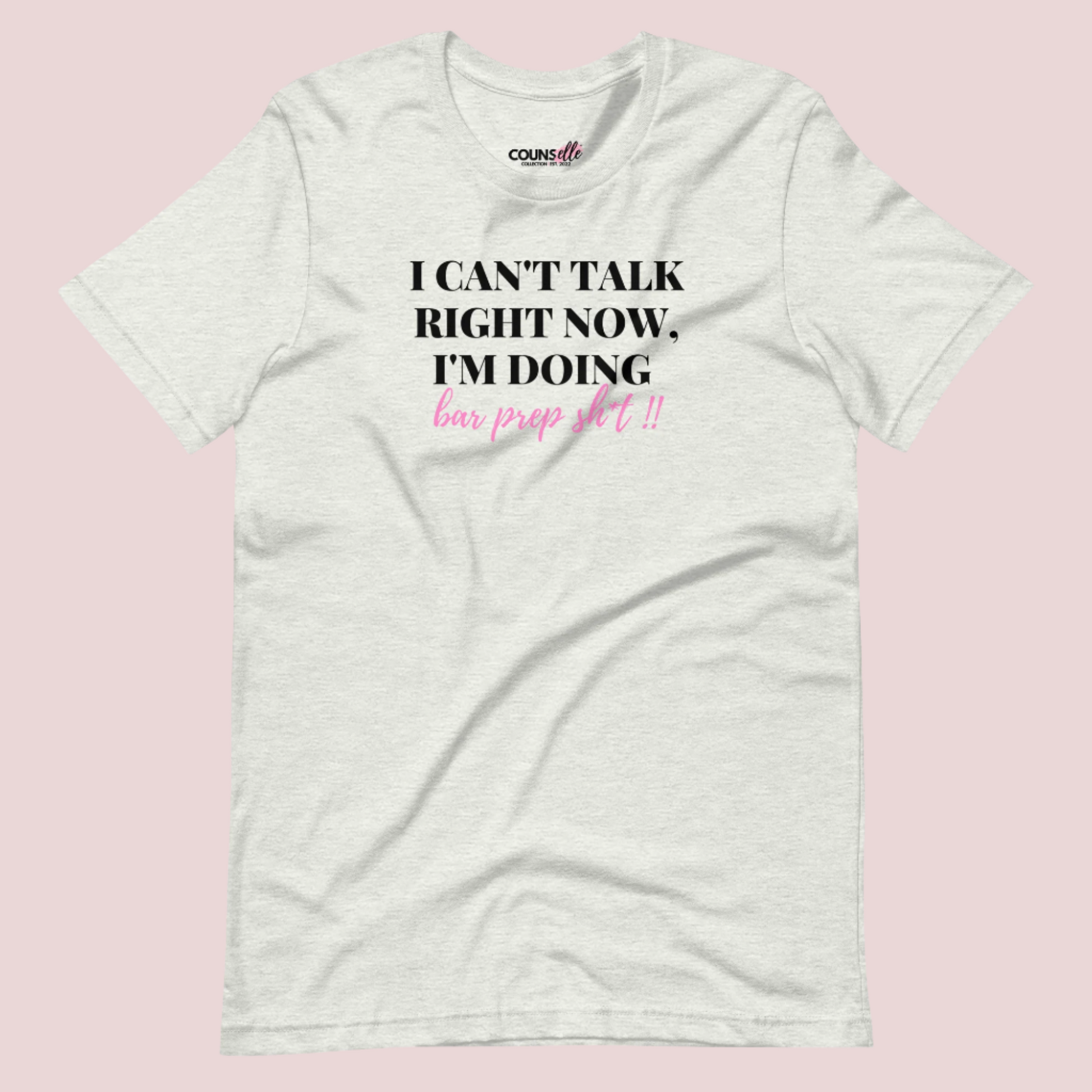 An ash grey roundneck tee showing the text "I CAN'T TALK RIGHT NOW, I'M DOING BAR PREP SH*T!"