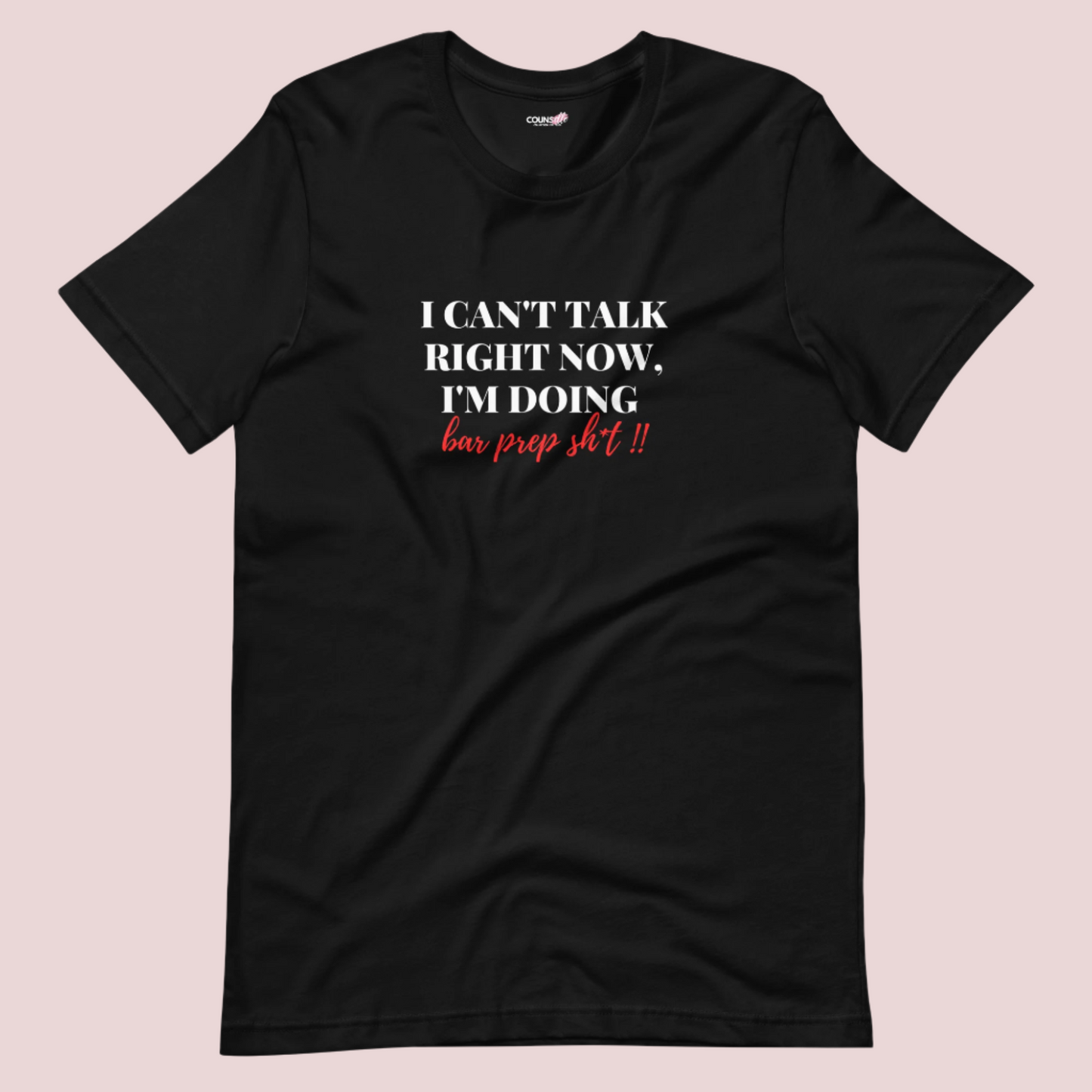 A black roundneck tee showing the text "I CAN'T TALK RIGHT NOW, I'M DOING BAR PREP SH*T!"