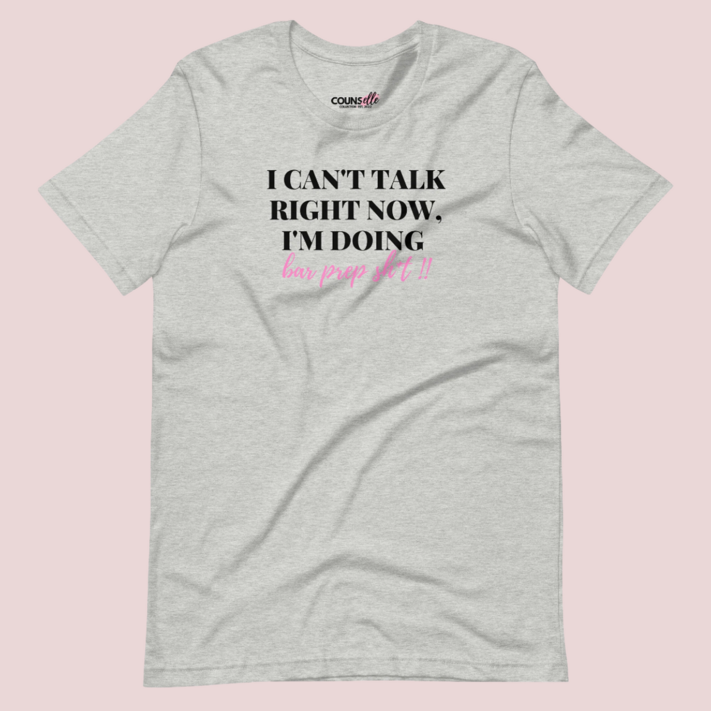 A grey roundneck tee showing the text "I CAN'T TALK RIGHT NOW, I'M DOING BAR PREP SH*T!"