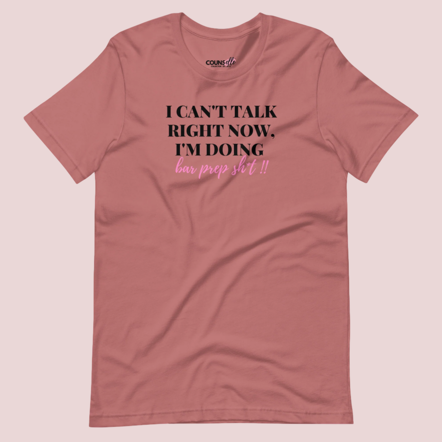 A mauve roundneck tee showing the text "I CAN'T TALK RIGHT NOW, I'M DOING BAR PREP SH*T!"