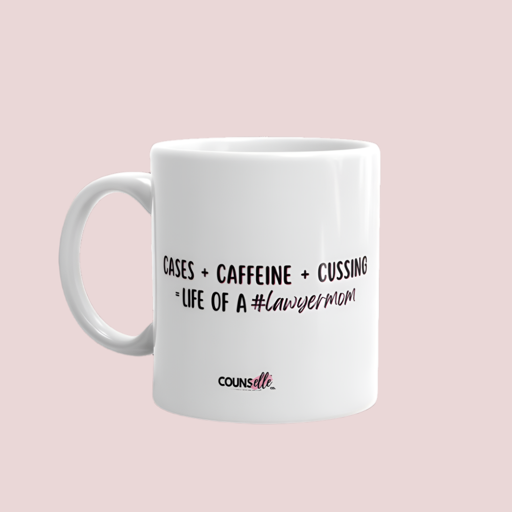 A white mug with the text "Cases + Caffeine + Cussing = LIFE OF A #lawyermom", and the counsellecollection logo at the bottom of the design