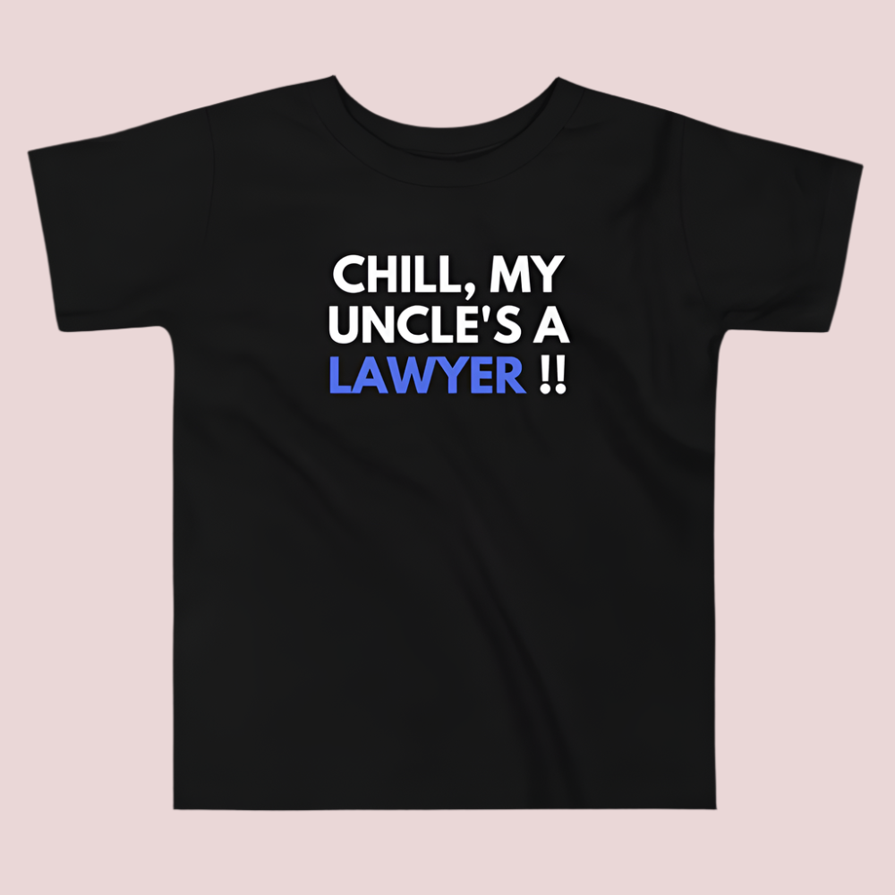 A black roundneck kid's tee featuring the quote "Chill, my uncle's a lawyer" in uppercase text.