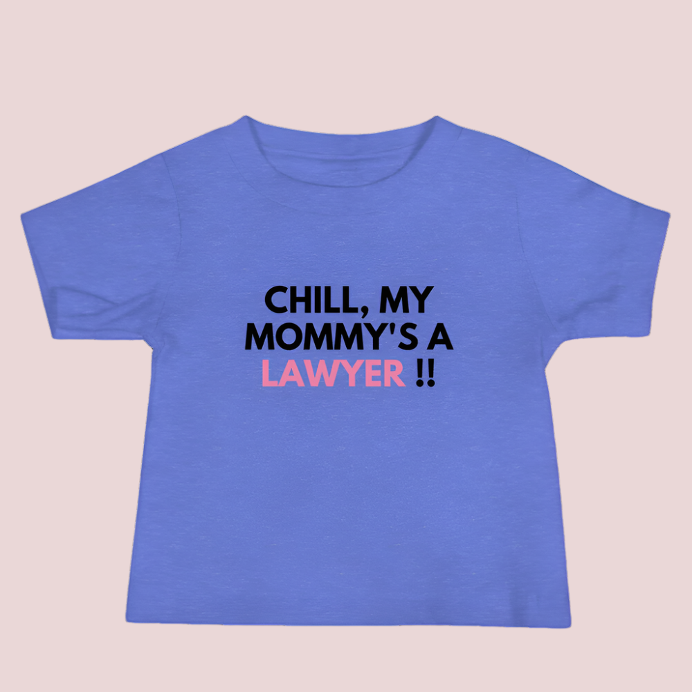 A blue roundneck kid's tee featuring the quote "Chill my mommy's a lawyer" in uppercase text.