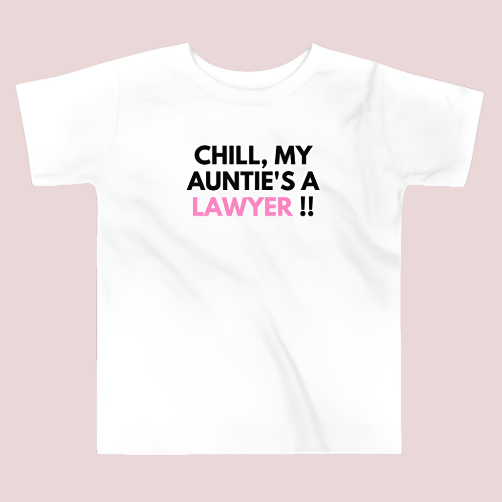 A white roundneck kid's tee featuring the quote "Chill, my auntie's a lawyer" in uppercase text.