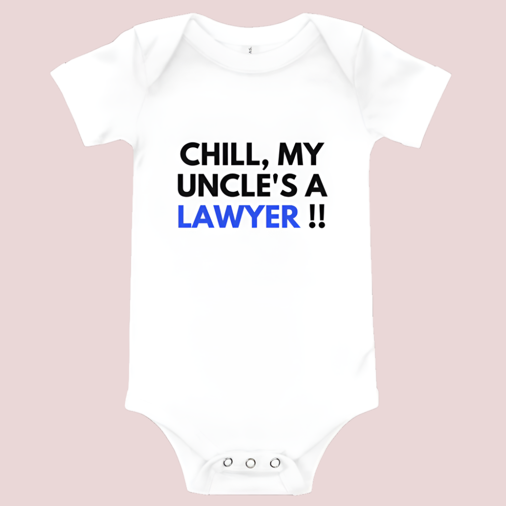 A white baby onesie with a three-snap leg closure featuring the quote "Chill my uncle's a lawyer" in uppercase block text.