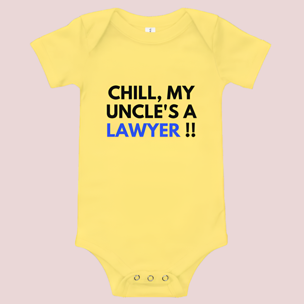 A yellow baby onesie with a three-snap leg closure featuring the quote "Chill my uncle's a lawyer" in uppercase block text.