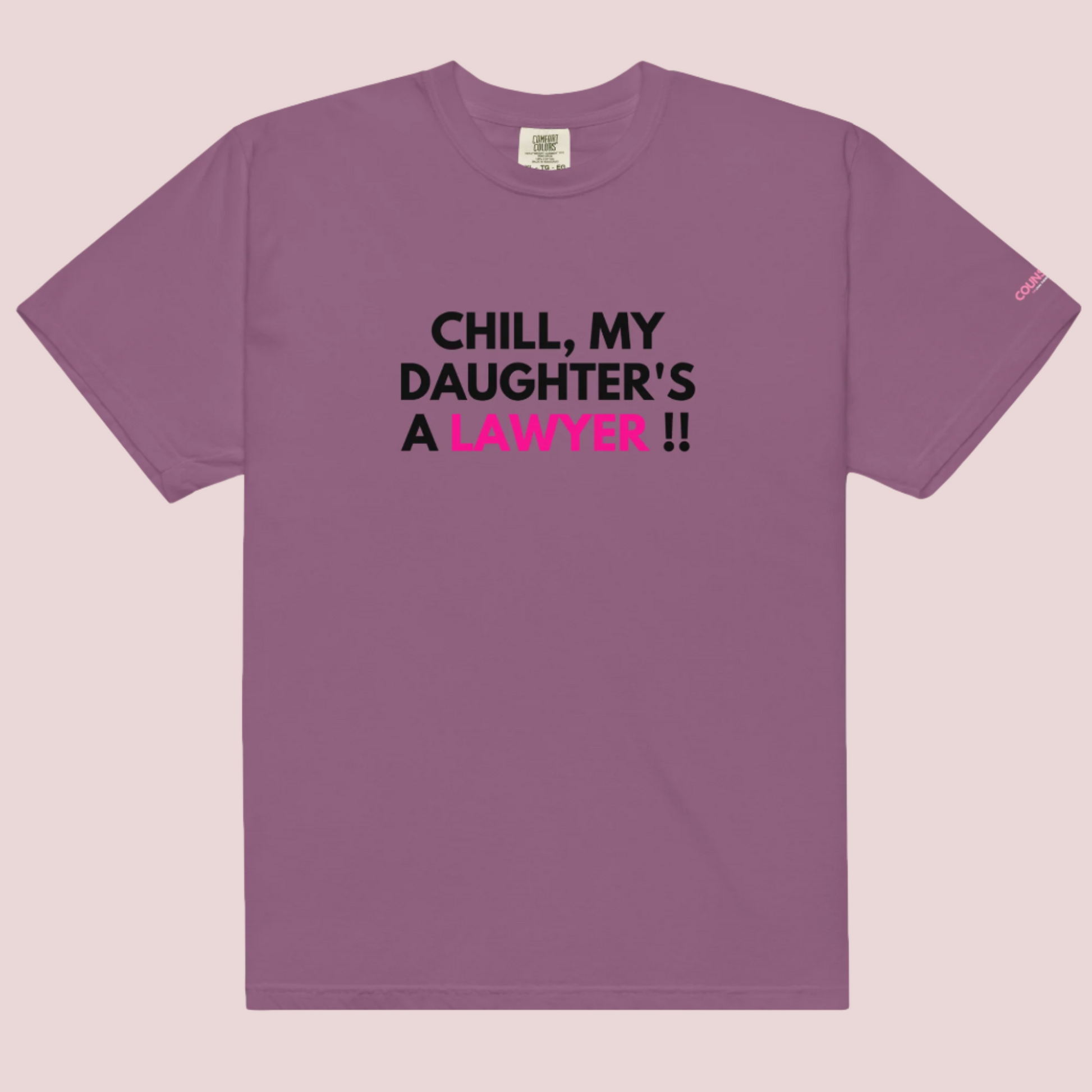 A berry roundneck t-shirt with the slogan "CHILL MY DAUGHTER'S A LAWYER." and the counsellecollection logo on the left sleeve.