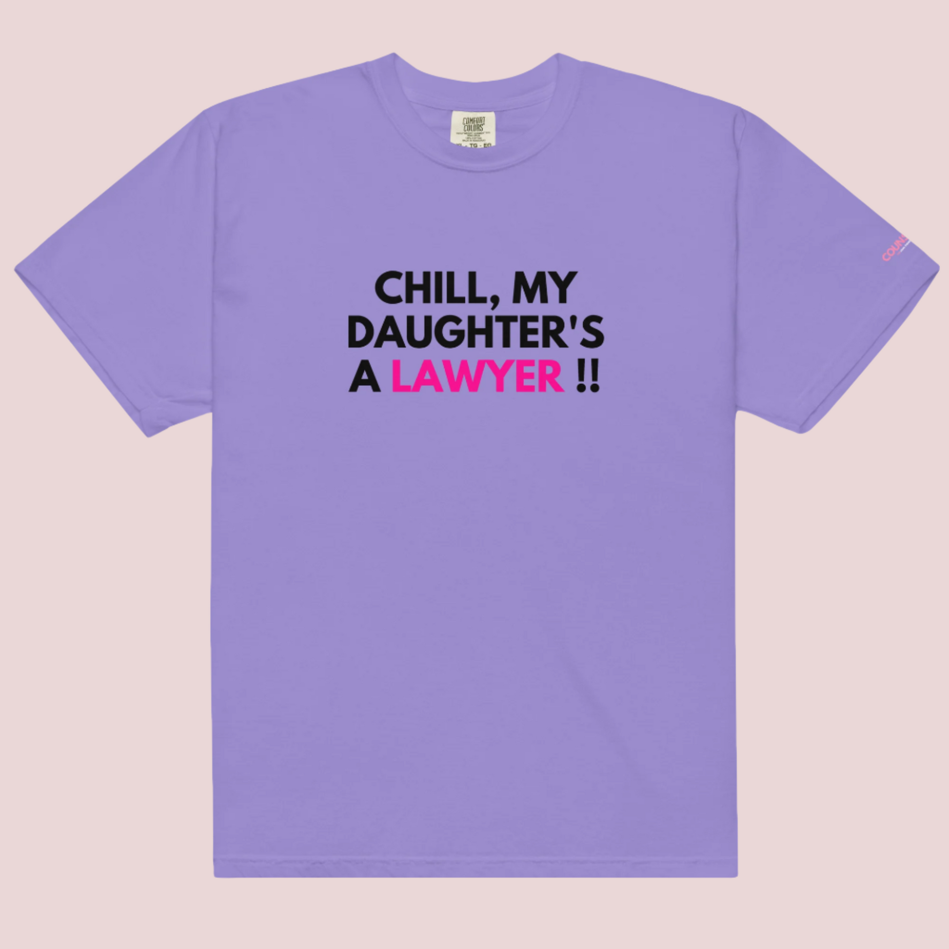 A grape roundneck t-shirt with the slogan "CHILL MY DAUGHTER'S A LAWYER." and the counsellecollection logo on the left sleeve.
