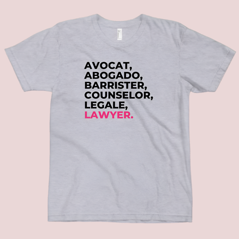 A heather grey, short sleeved tee with the word "LAWYER" translated into multiple languages.