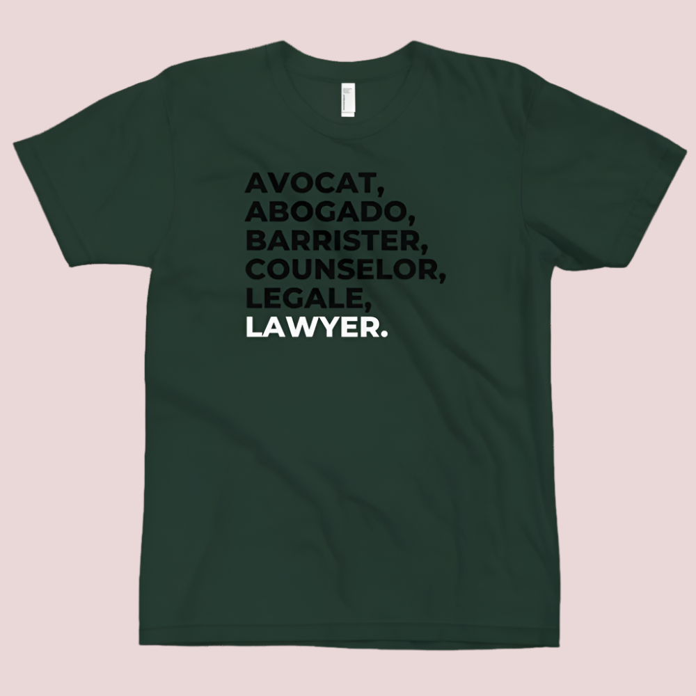 A short sleeved dark/hunter green tee with the word "LAWYER" translated into multiple languages.