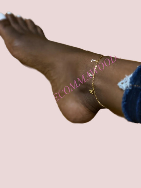 The “LAW” Anklet features the letters "LAW" in block font as a charm on a delicate chain.