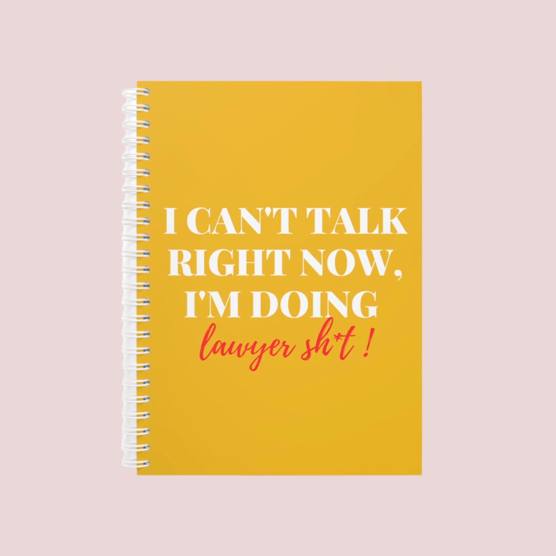 A Yellow notebook with the phrase "I can’t talk right now, I’m doing Lawyer sh*t" on the cover. Ring-bound with ruled pages.