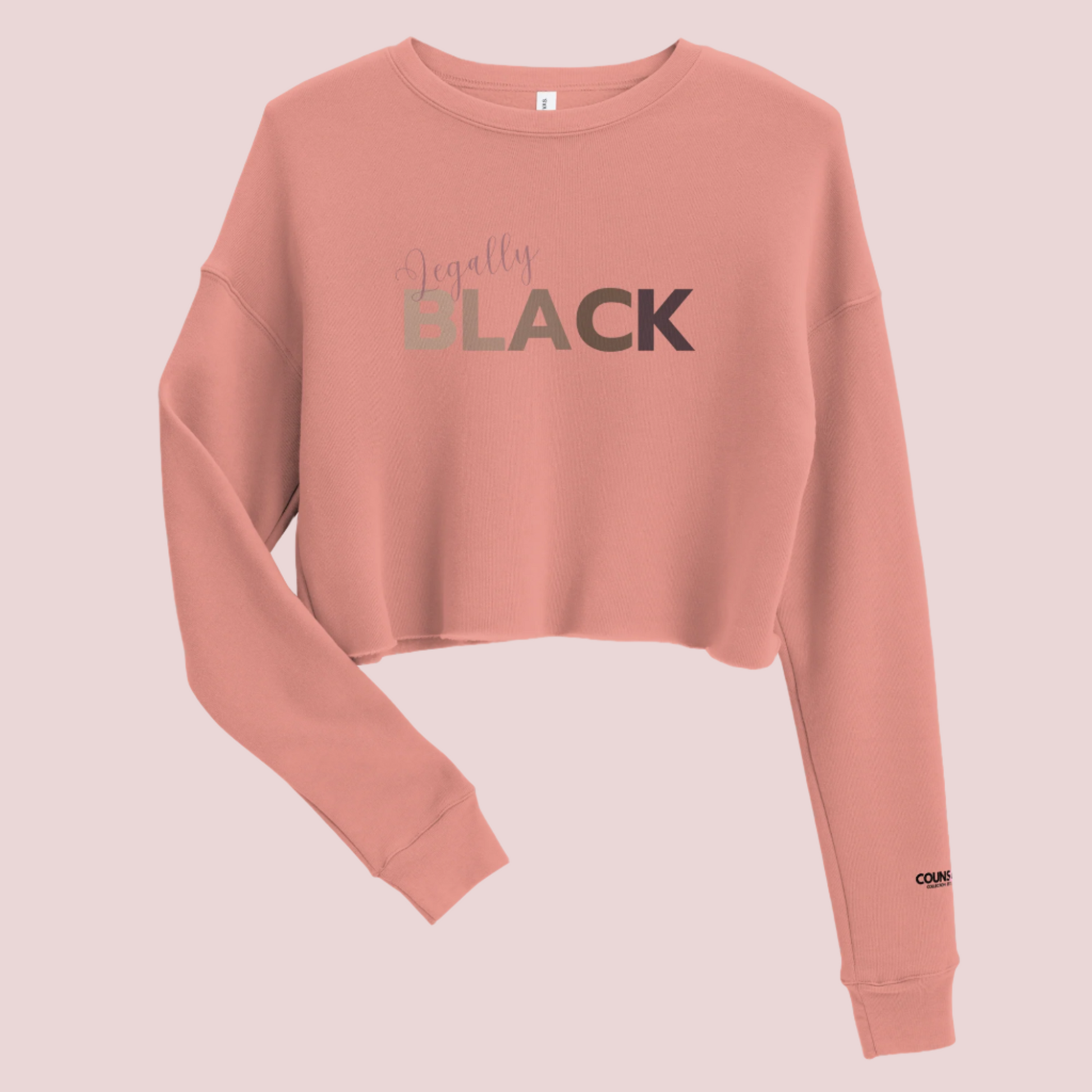 A rose, roundneck, long-sleeved tee, with the text "Legally", in script, and "BLACK" in uppercase font. The counsellecollection logo is seen on the left sleeve.