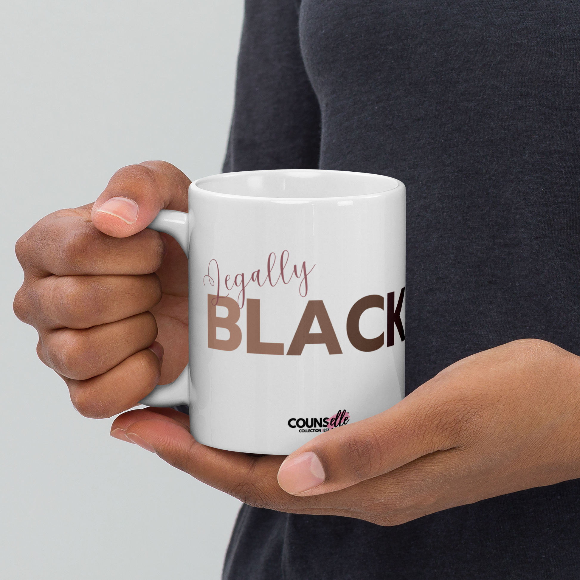 A white ceramic mug featuring the word "LEGALLY" in script font and the word "BLACK" in bold text with the counsellecollection logo at the bottom of the design.
