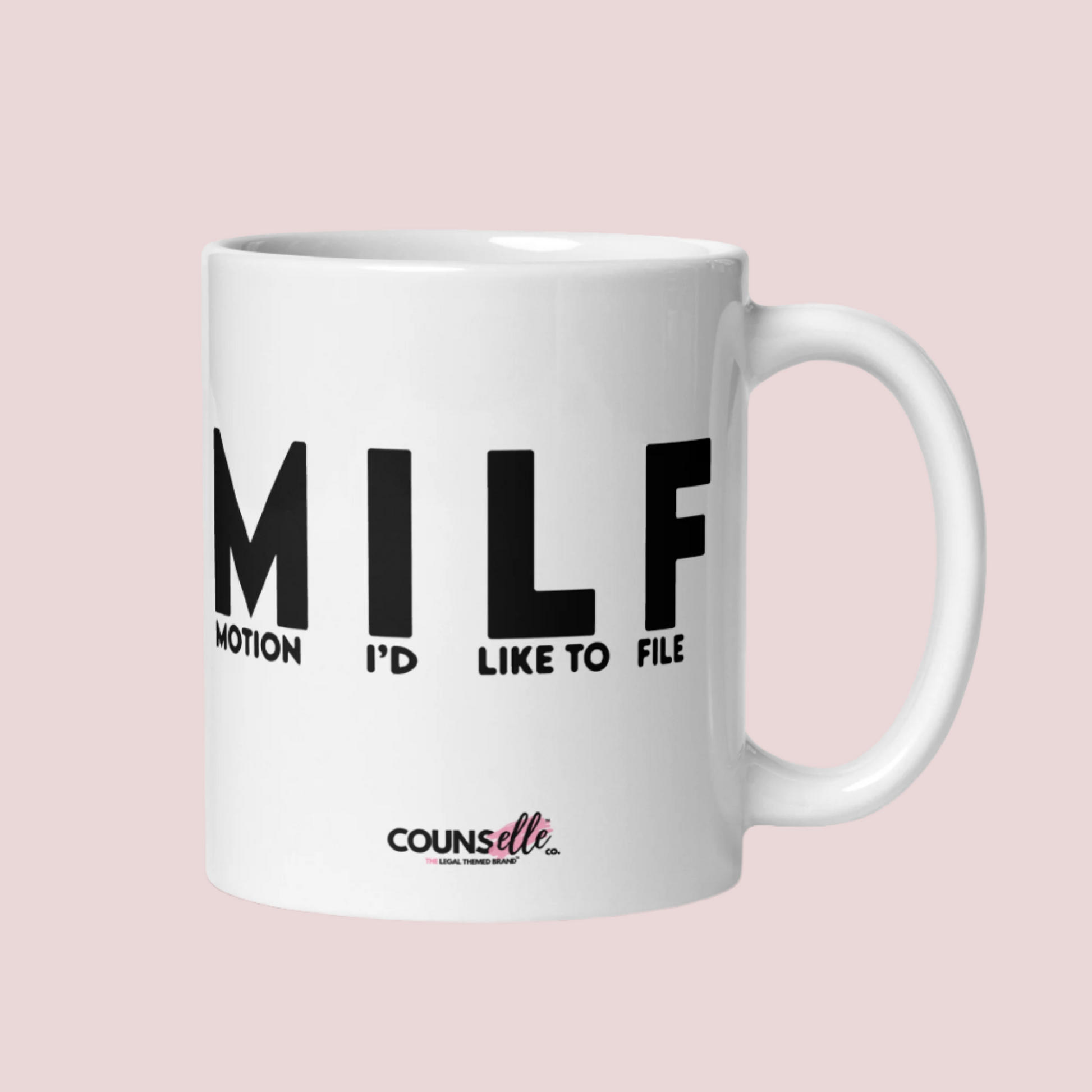 A white mug with the letters "MILF" and the words "MOTION I'D LIKE TO FILE" in black uppercase font and the counsellecollection logo at the bottom of the mug