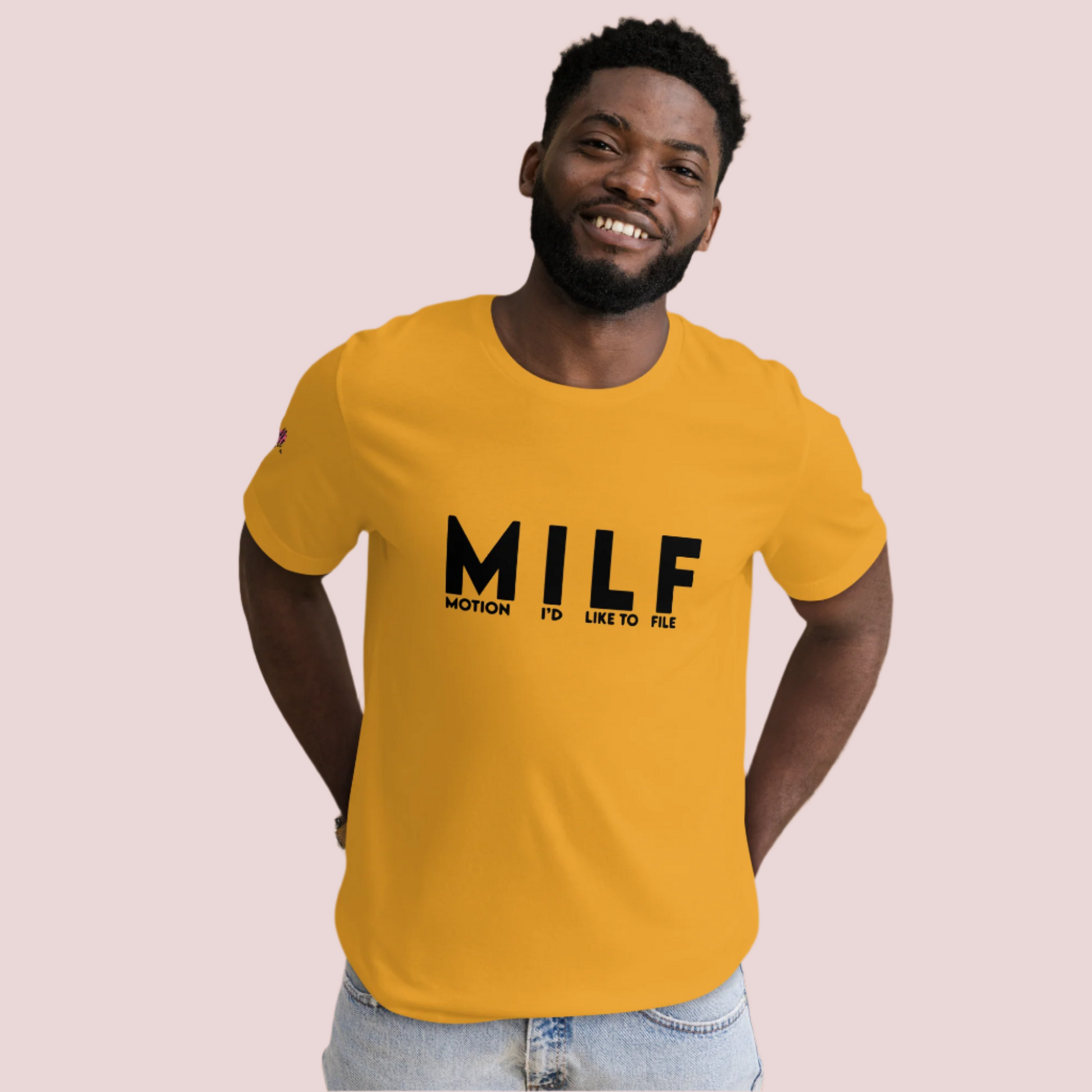 A mustard round-neck tee with the letters "MILF" and the words "MOTION I'D LIKE TO FILE" in black uppercase font and the counsellecollection logo on the right sleeve