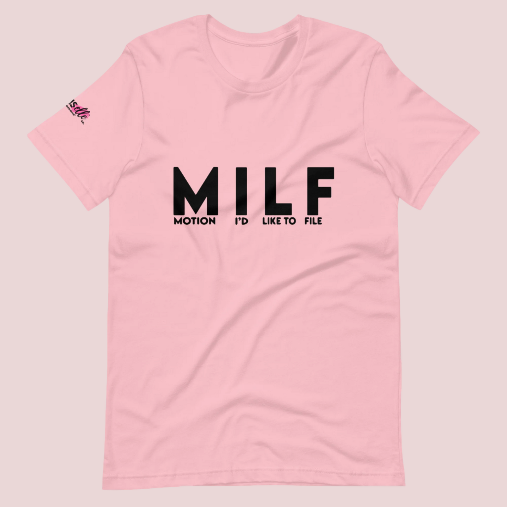 A pink round-neck tee with the letters "MILF" and the words "MOTION I'D LIKE TO FILE" in black uppercase font and the counsellecollection logo on the right sleeve