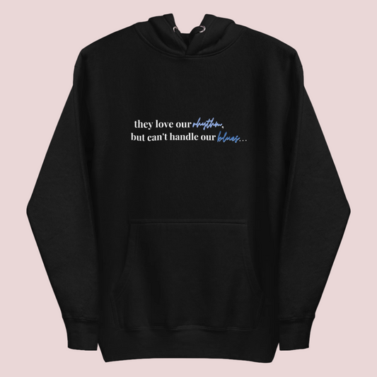A black crewneck long-sleeved hoodie with the text "they love our rhythm but can't handle our blues"