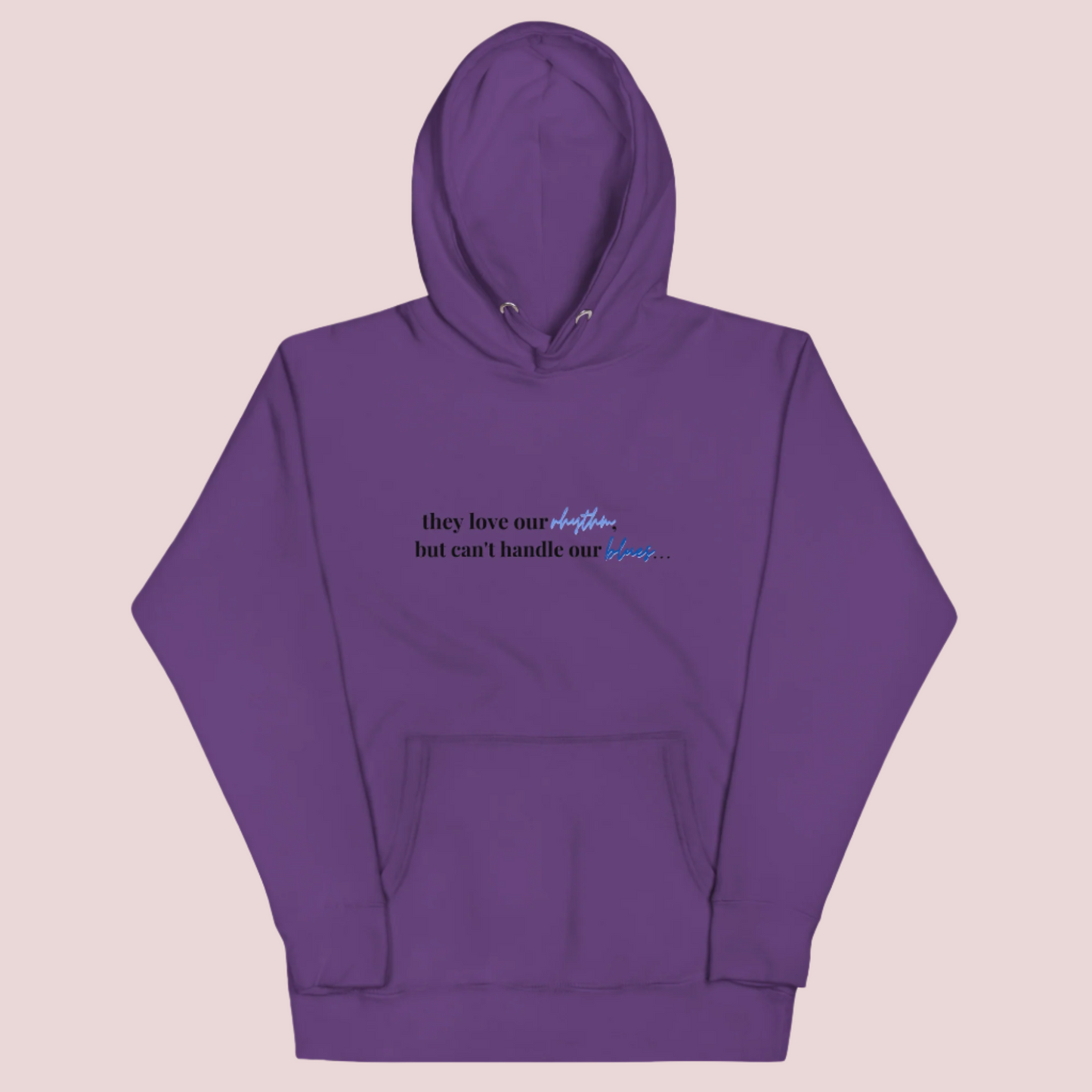 A purple crewneck long-sleeved hoodie with the text "they love our rhythm but can't handle our blues"