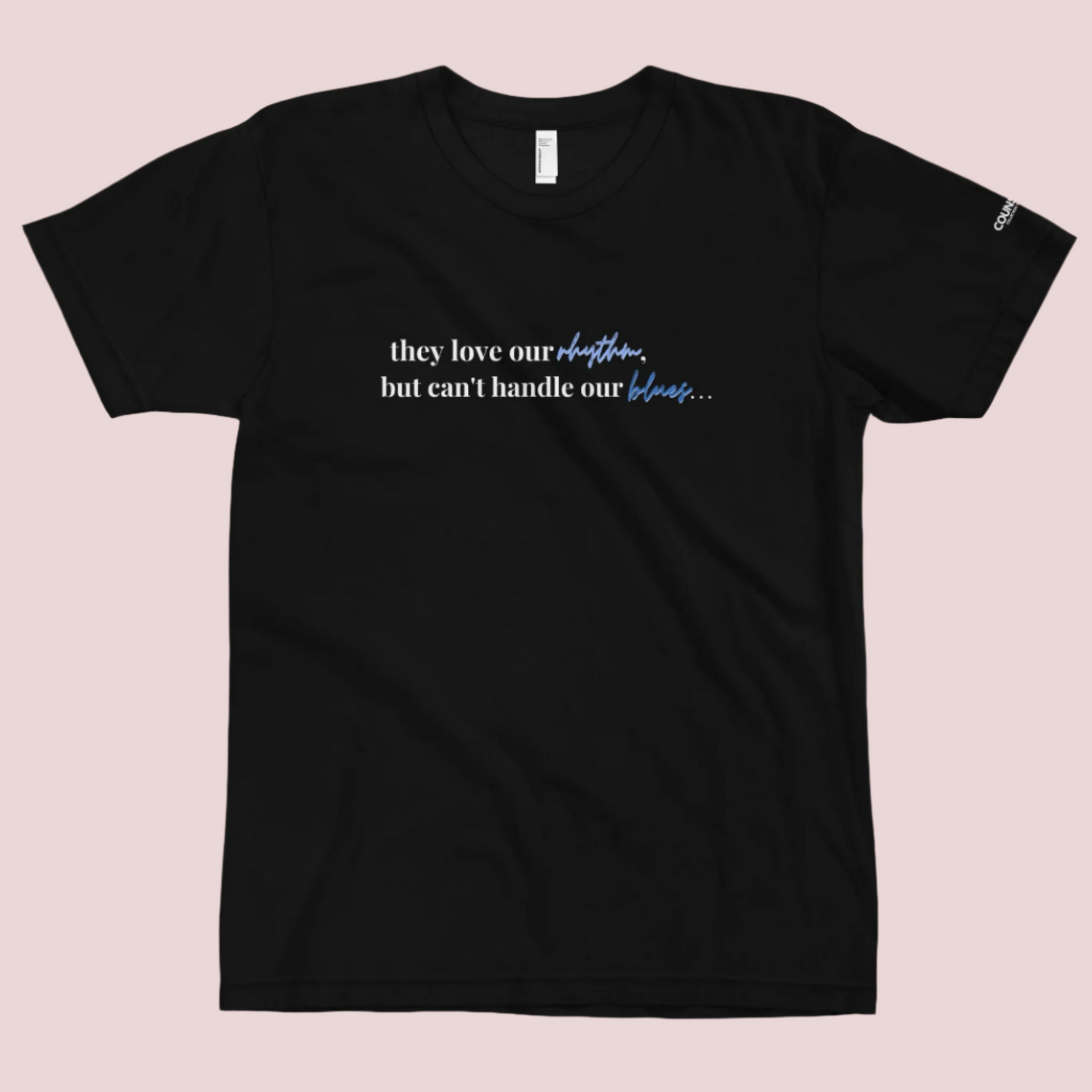 A black t-shirt with the text "They love our rhythm, but they can't handle our blues" on the front.