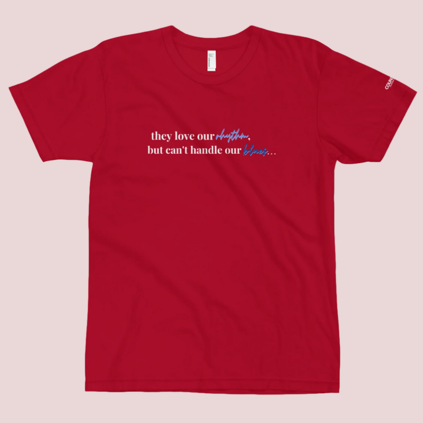 A red t-shirt with the text "They love our rhythm, but they can't handle our blues" on the front.