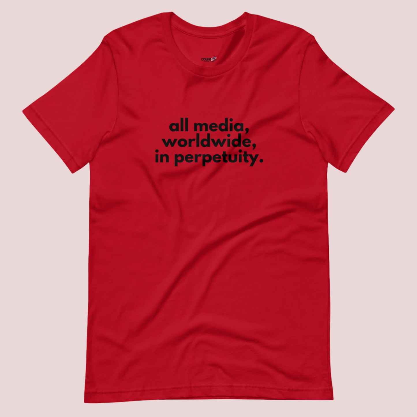 A red roundneck tee showing the text "all media, worldwide, in perpetuity."