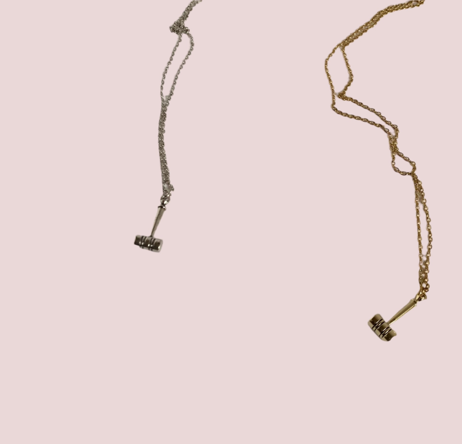 One gold and one silver necklace featuring a sleek gavel pendant.