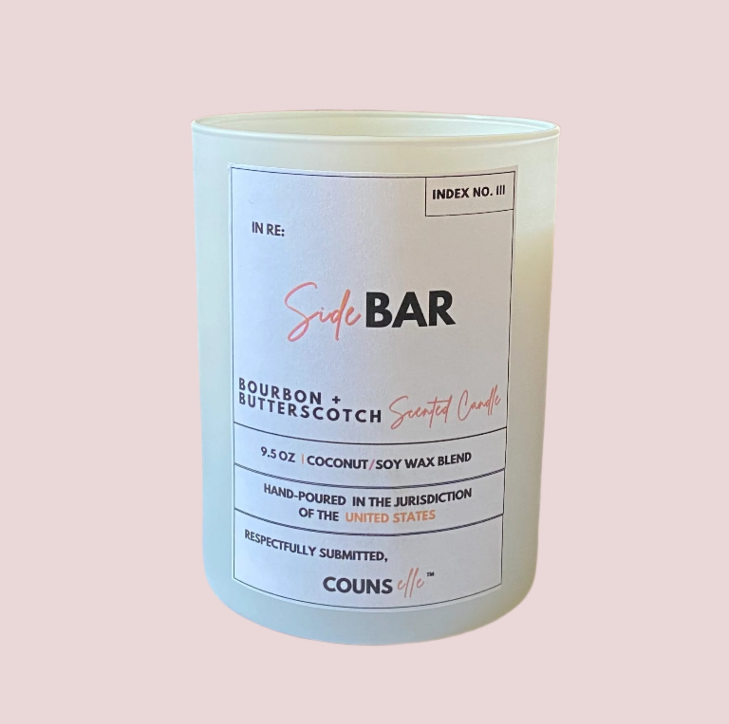 A candle in a white container with a white label featuring the text "INDEX NO. III", "IN RE:", "SIDEBAR", "BOURBON + BUTTERSCOTCH SCENTED CANDLE", "9.5 oz", "COCONUT/SOY WAX BLEND", "HAND-POURED IN THE JURISDICTION OF THE UNITED STATES", "RESPECTFULLY SUBMITTED", with the counsellecollection logo at the bottom of the design.
