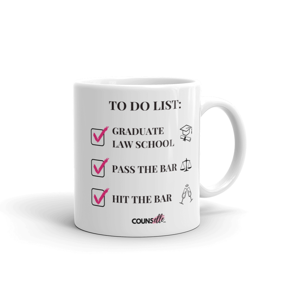 A white mug with a to-do list of graduate law schooll, pass the bar, hit the bar