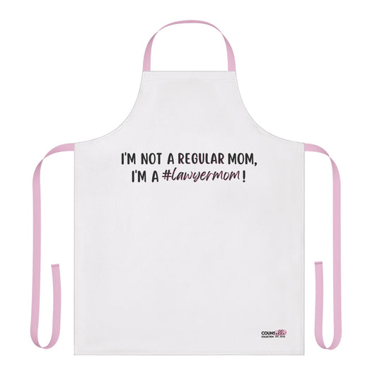 A white apron with the text "I'm not a regular mom, I'm a #lawyermom! - "The "Lawyer Mom" Apron by THE COUNSELLE COLLECTION™