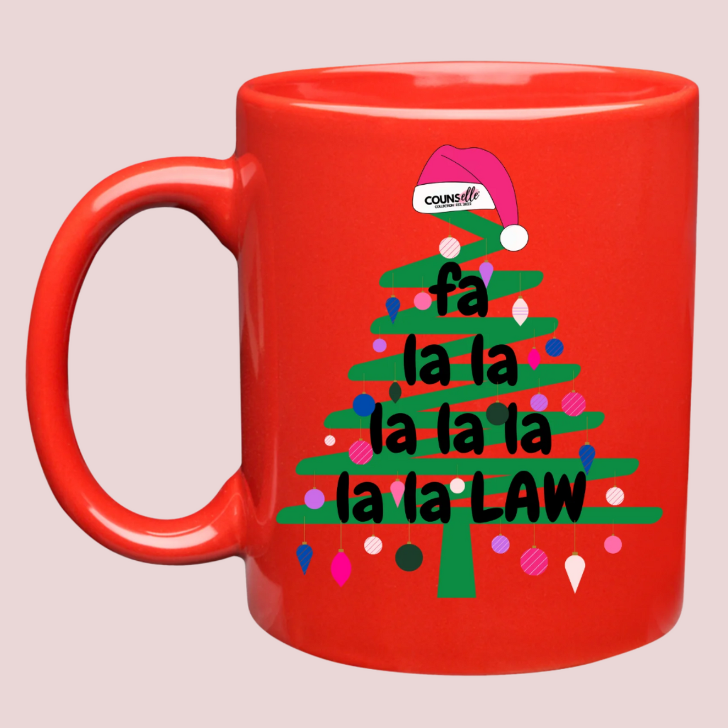 A red mug with an illustration of a green Christmas tree doodle with lights and a Santa hat on top, and the text "Fa La La La Law", with the counsellecollection logo on the Santa hat